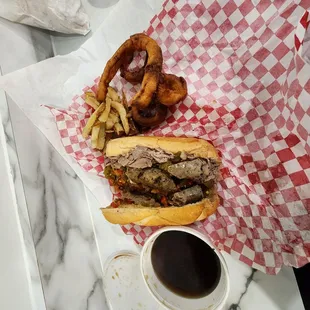 a sandwich and french fries on a tray
