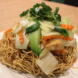 Crispy Vegan Seafood Noodles made with vegan shrimp, tofu and mixed veggies in a delectable sauce poured over crispy wheat noodles.