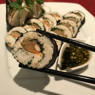 Our Living Foods Dragon Roll is a nutrient-rich and delicious vegan sushi. With cultured macadamia cheese and housemade kimchi.