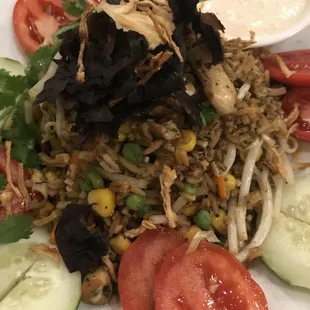 Our Living Foods T. Anh Fried Rice features enzyme-rich soaked wild rice, tamari-spiced veggies, sea veggies and a macadamia cream sauce.