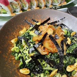 Our classic salad of kale and sea veggies with teriyaki dressing, spiced almonds, and kimchi. Enjoy with chef&apos;s tuna roll. Bon appetit!