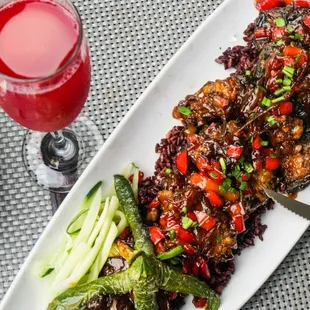 Octopus - tenderized, battered shiitake mushrooms w/ tamari-sesame glaze, chives, bell pepper &amp; jalapeño. served w/ black rice.