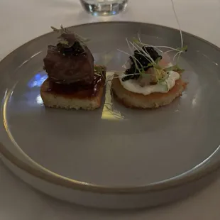 Umami and savory. On left is Kobe beef.  The one on right was a base of a potato pancake cooked in Kobe fat.  Amazing