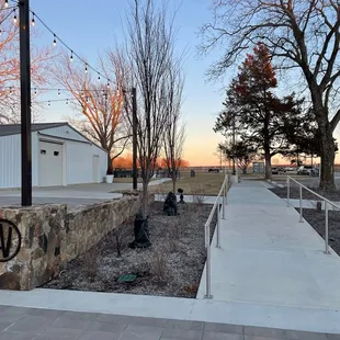 a walkway leading to a winery