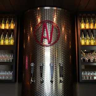 a large wine barrel with a logo on it