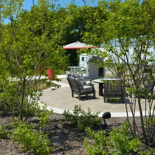 a patio with a table and chairs