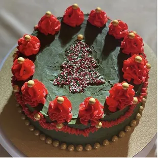 a cake decorated with red roses