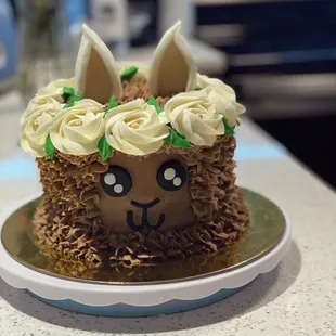 a cake decorated like a llama