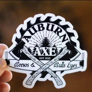 a person holding a sticker