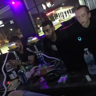 a group of men sitting at a table