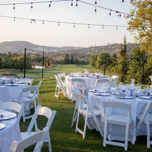 Beautiful outdoor wedding reception with the view of the back nine.