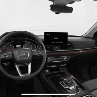 Interior has dark wood trim in this color package- I love it!