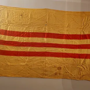 Embassy flag from Tet offensive of 1968. With bullet holes and blood stains