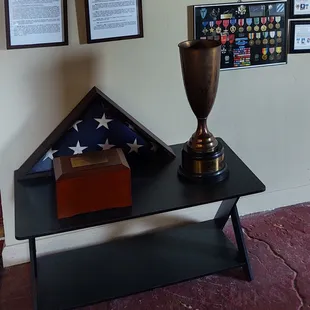 Closeup of trophy and Matriarch burial flag.