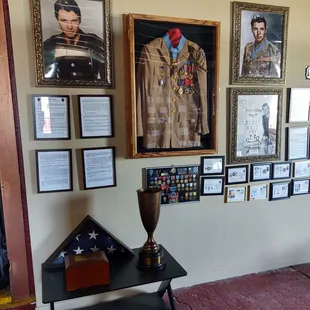Picture of Audie Murphy Uniform and a trophy for his horse Joe Queen