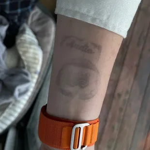 a person's wrist with a tattoo on it