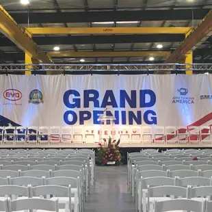 Grand opening at Manufacturing facility with stage, sound, lights, and kabuki drop