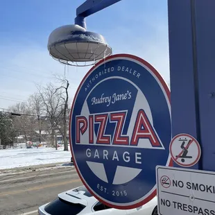 a car parked in front of the sign