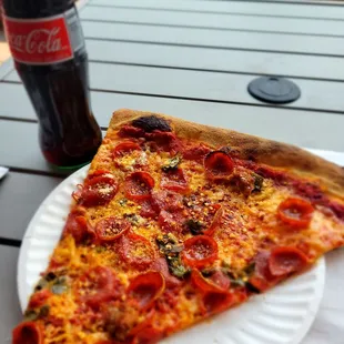 Cold Coke and hot slice of spicy pig!