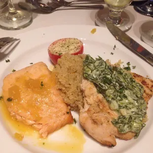 Main course: Salmon with chutney, chicken with spinach and cheese, quinoa and parmesan mozzarella tomato garnish.
