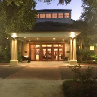 Sun going down. Walking up to front doors.