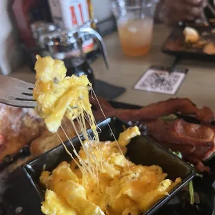 Scrambled eggs w/ cheddar and a side of Pork Bacon