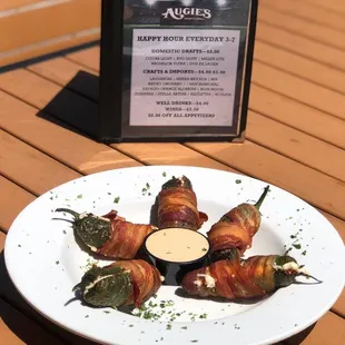 bacon wrapped jalapenos on a plate