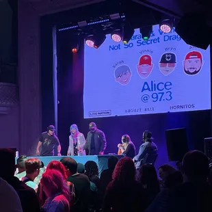 a group of people on stage