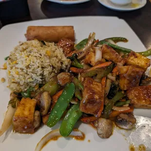 Garlic tofu lunch special with egg fried rice and spring roll.