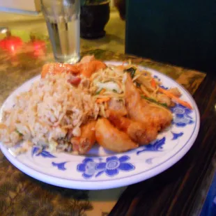 Sweet and sour chicken, fried rice, and fried shrimp