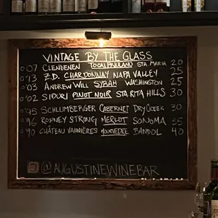 a chalkboard with a list of wines