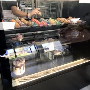 a display case filled with donuts