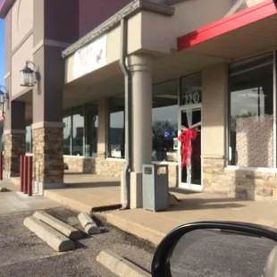 a reflection of a person in a car mirror