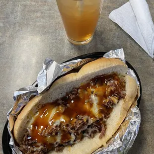 Smoked BBQ Beef Brisket Dog w/ yummy Arnold Palmer in the back