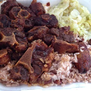 Large oxtail, pea&apos;s and rice with extra gravy and a side of cabbage and sweet plantains.