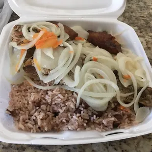 Escovitch fish with rice and peas and cabbage salad. Flavorful and a great portion