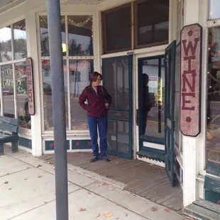 a woman standing in front of the door