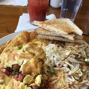 Western omelette, hash browns, rye toast and a Bloody Mary.
