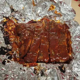 a piece of meat wrapped in tin foil