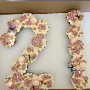the number 2 decorated with flowers and butterflies