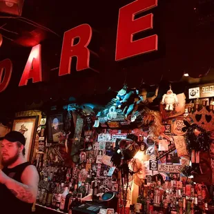 a man standing in front of a bar