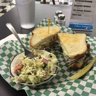 Hot Roast Beef with coleslaw on the side.  Delicious with melted cheese, red onions, fresh crispy lettuce.