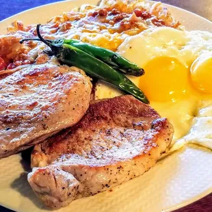 Chops and eggs with chilli cheese hash - tender with good flavor. Added grilled serrano chili peppers for a kick