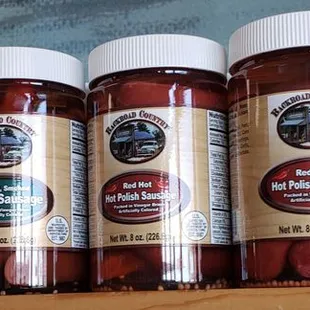 a row of jars of hot dogs