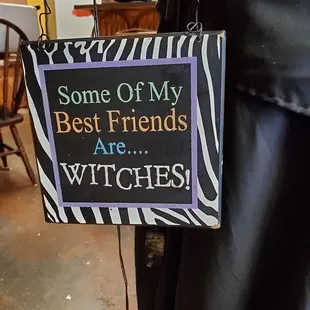a sign saying some of my best friends are witches