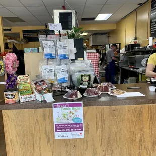a woman standing behind the counter