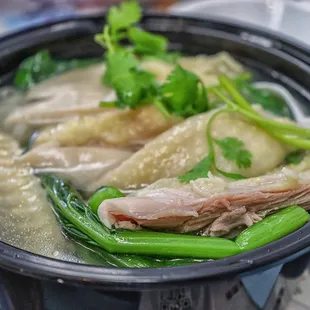  bowl of soup with meat and vegetables