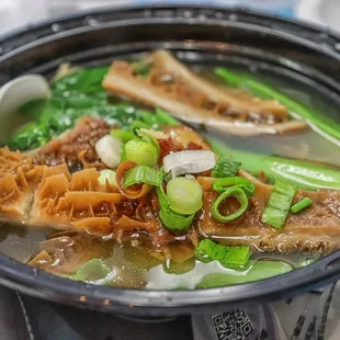  bowl of soup with meat and vegetables