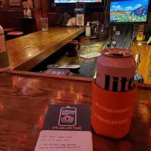 a can of beer on the bar