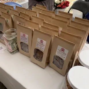 a man standing in front of a table full of cookies